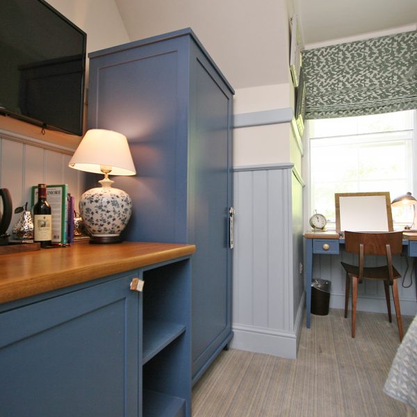 Bespoke Boutique Hotel Casegoods in Blue and Pine
